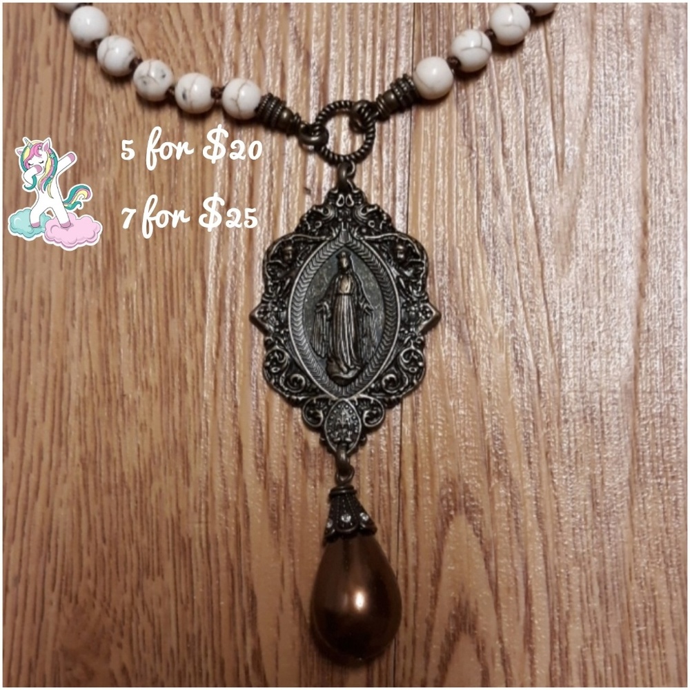 Long beaded necklace oval medallion